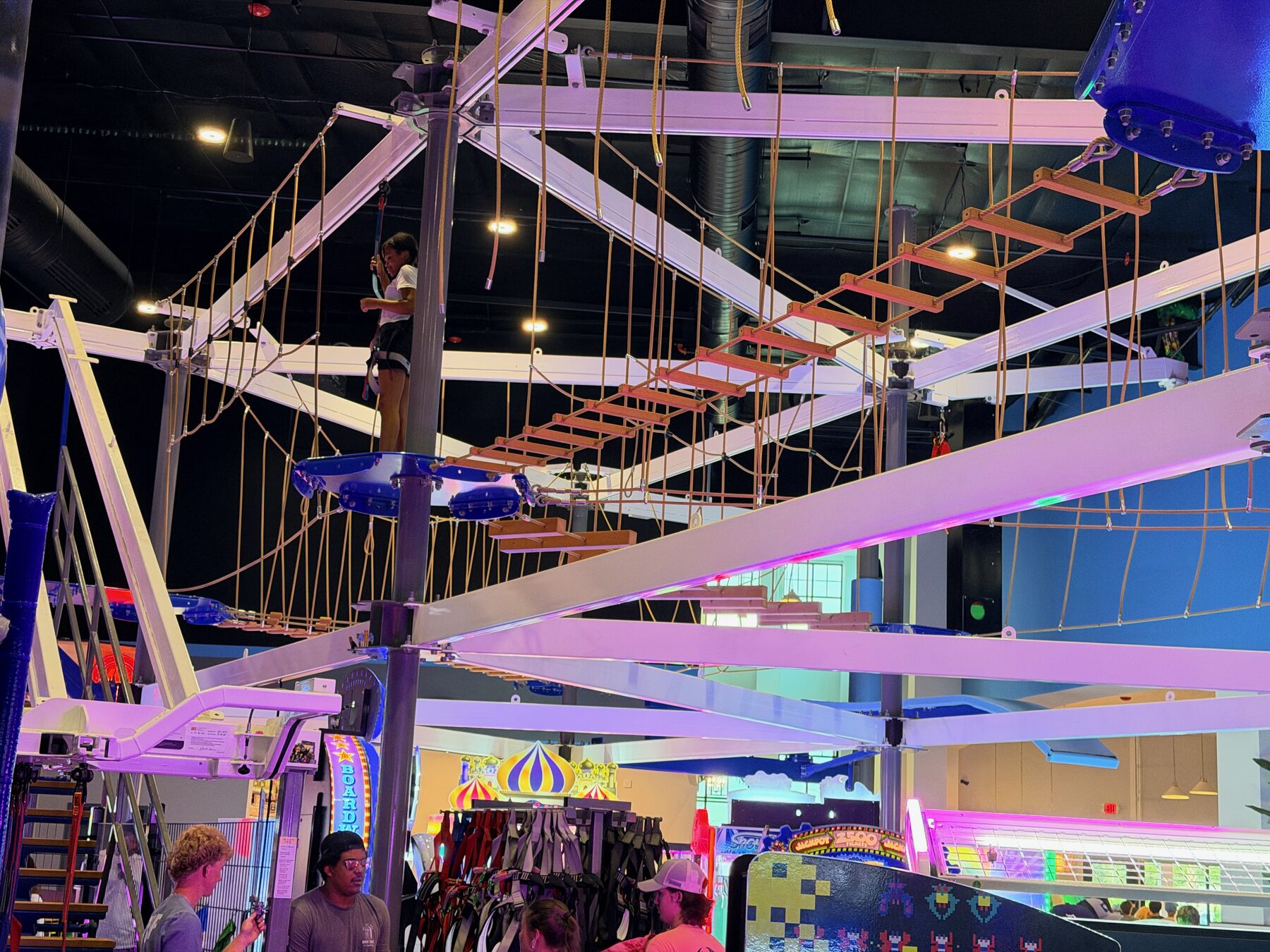 Indoor ropes course suspended above the High Tides entertainment floor