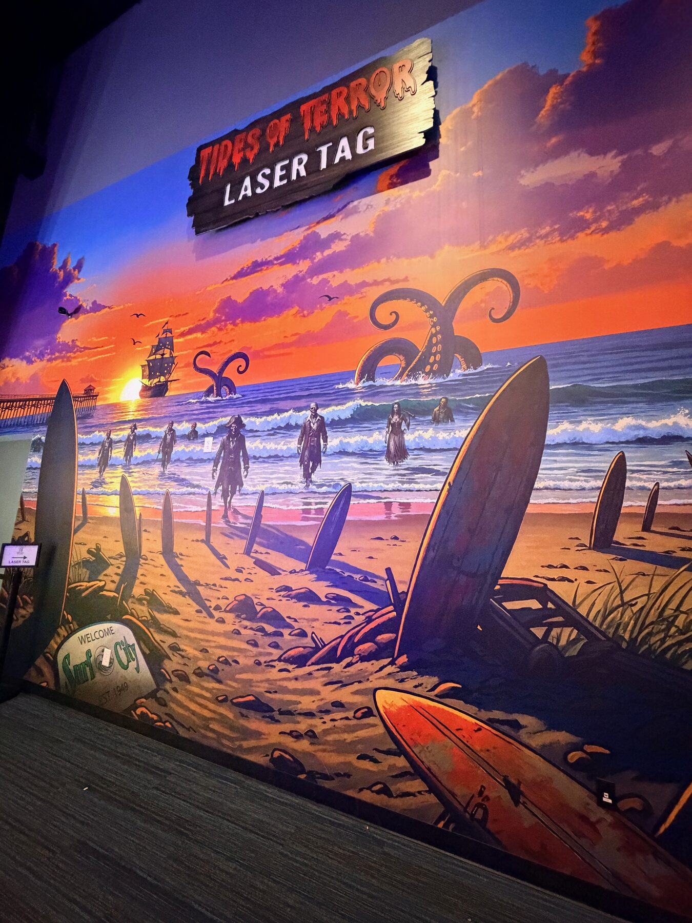 Coastal mural at the entrance to the High Tides laser tag arena