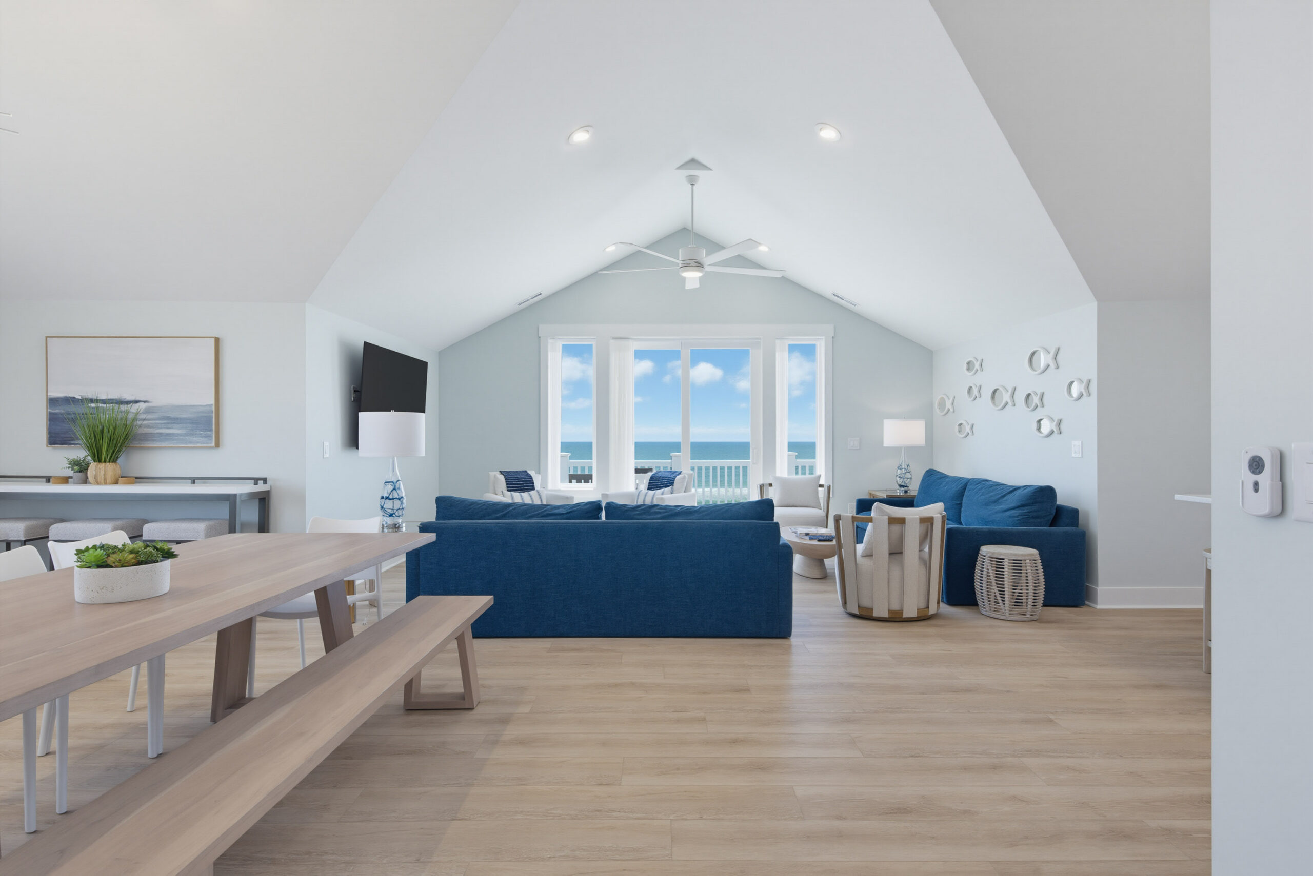 Ocean-view living room inside Ocean Chateau, a ten-bedroom Topsail Island vacation home