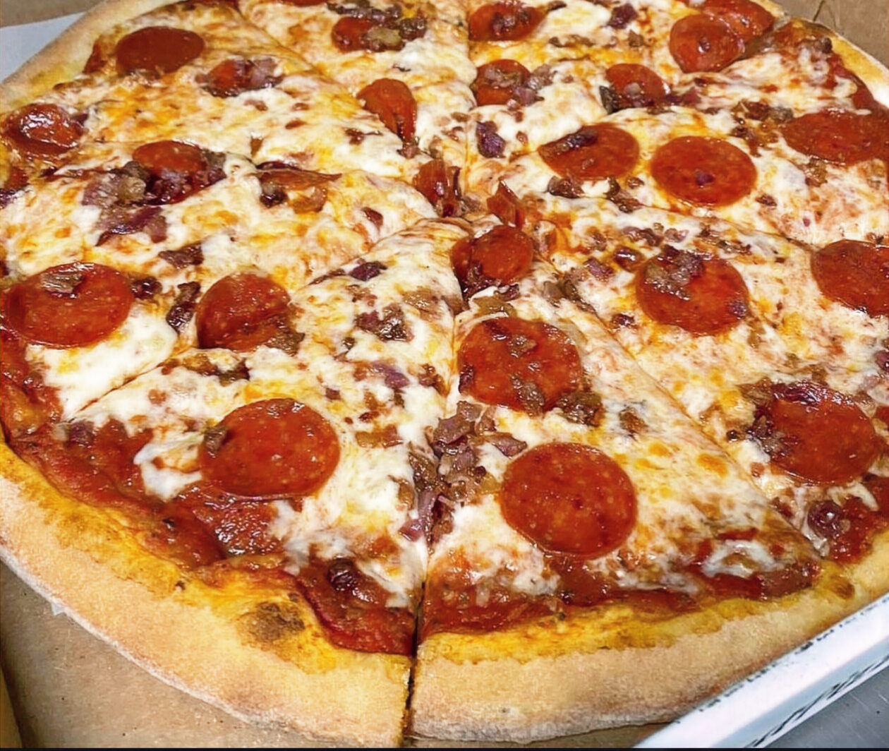 A sliced pepperoni pizza from Baked Pizza Company