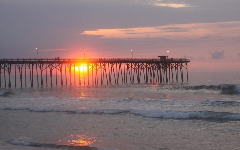 Sunrise behind Kure Beach Pier