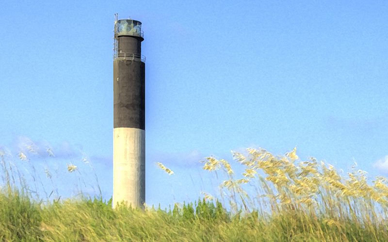 The Oak Island Lighthouse above sea oats