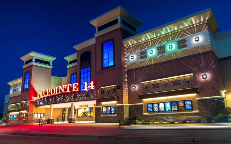 The Pointe 14 theater lit up at night