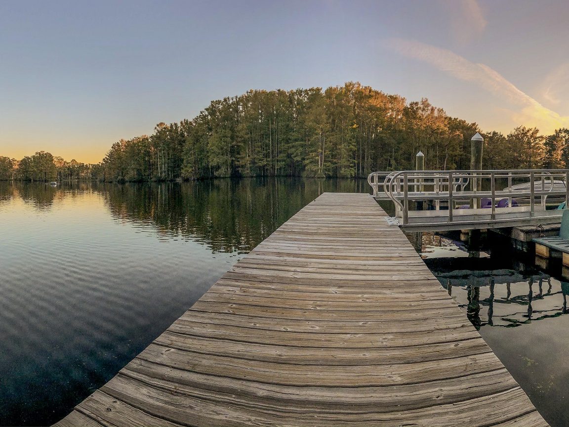 Paddleboats at the Greenfield Lake boathouse at sunset