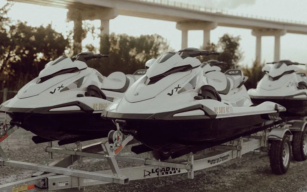 Jet skis loaded on a delivery trailer
