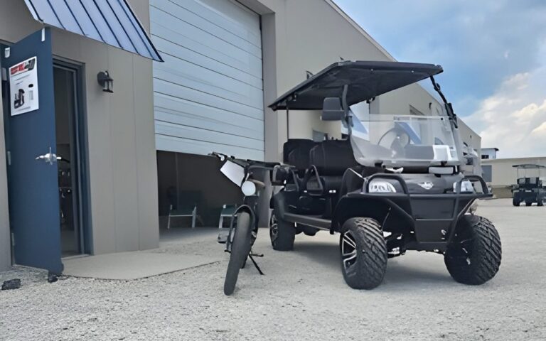 A black street-legal golf cart outside the Revel 42 store