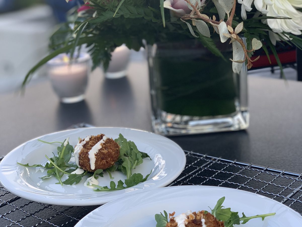A plated starter on a set table