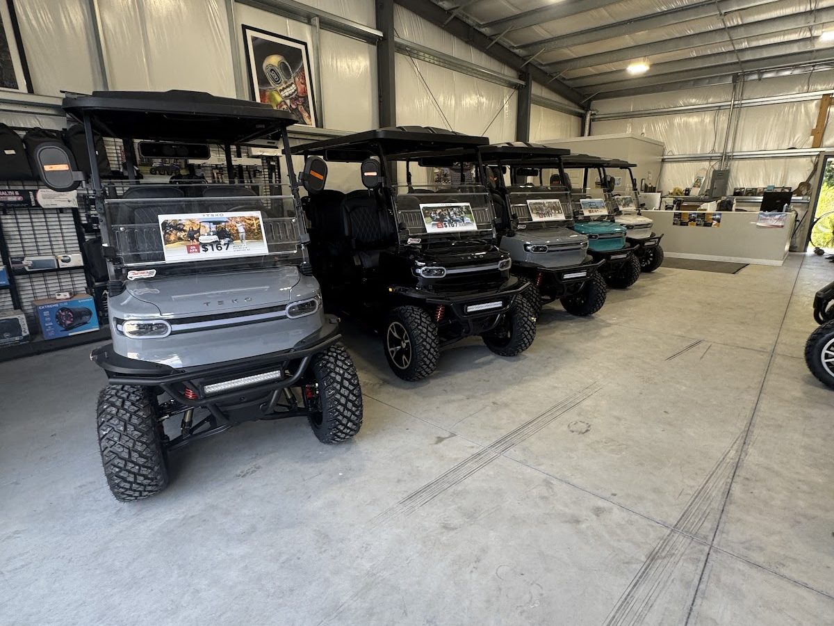 Rental golf carts inside the Surf City showroom