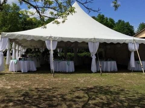 A white frame tent with set tables