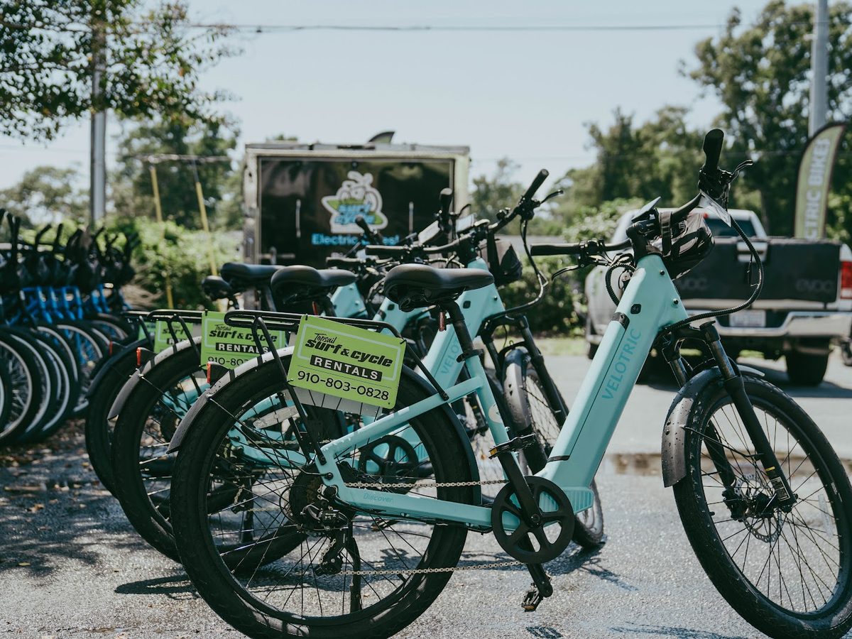 Rental e-bikes lined up outside the shop