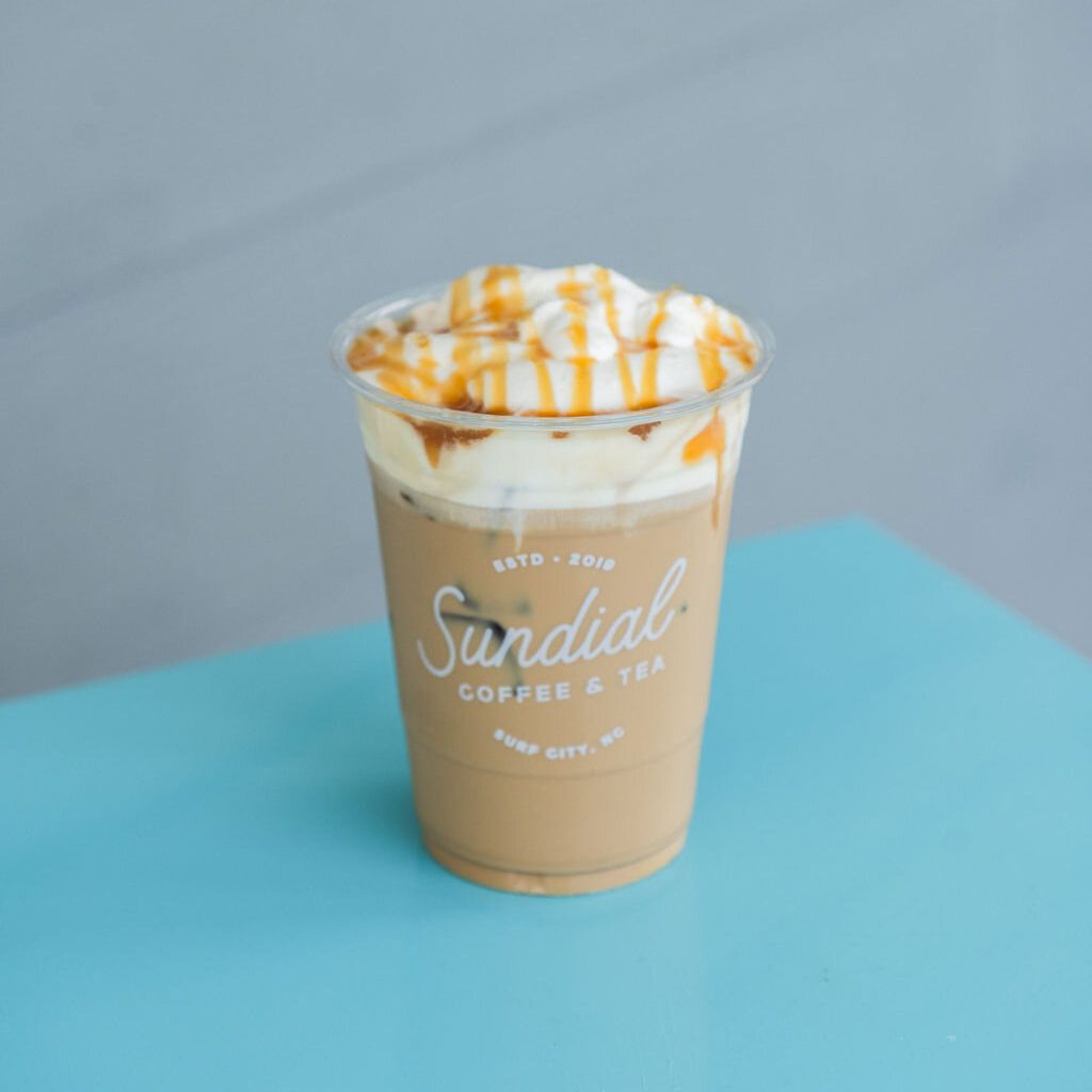The Sundial, an iced caramel latte with coconut cold foam, in a Sundial cup