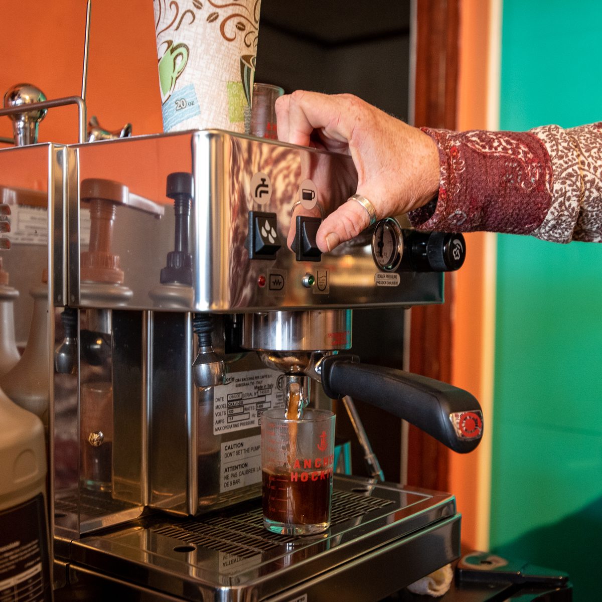 An espresso shot pulling at Surf City Coffee