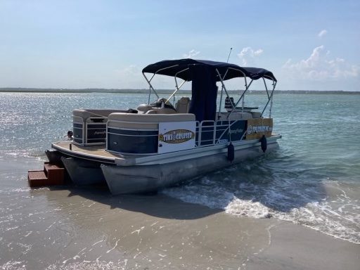 A Tiki Tours pontoon beached on Lea-Hutaff Island
